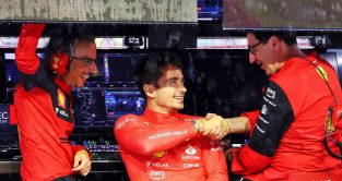 Laurent Mekies watches on as Charles Leclerc shakes hands with Mattia Binotto. Singapore October 2022