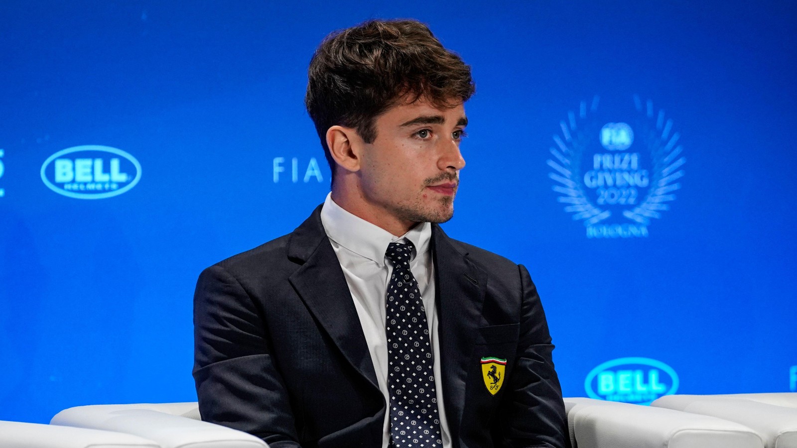 Ferrari driver Charles Leclerc in a suit. Italy, December 2022.