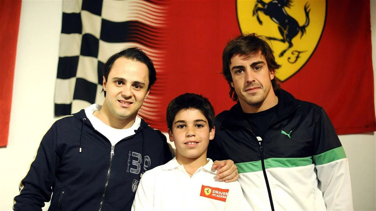 Felipe Massa and Fernando Alonso with Lance Stroll at the Ferrari driver academy.