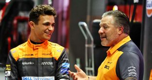 McLaren driver and CEO Lando Norris and Zak Brown stand together. Singapore September 2022.