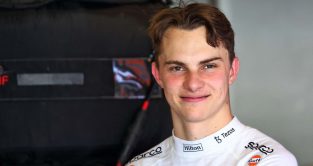 Oscar Piastri in the McLaren garage. Abu Dhabi November 2022.