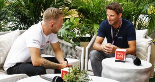 Kevin Magnussen and Romain Grosjean chat together. Miami May 2022.