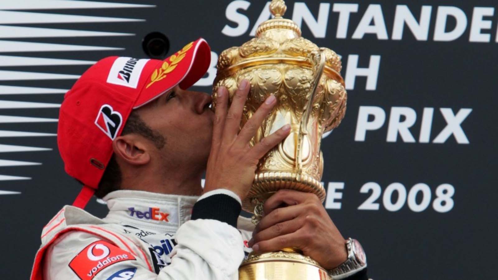 Lewis Hamilton holds the trophy aloft. F1 2008 Silverstone.