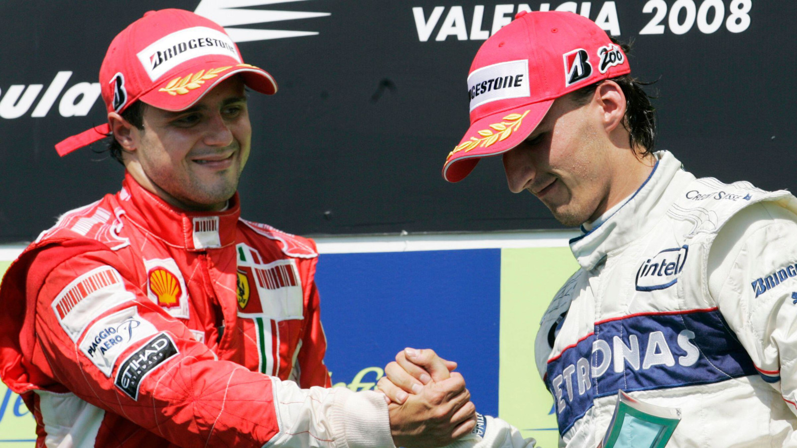 Felipe Massa shakes hands with Robert Kubica. Valencia August 2008