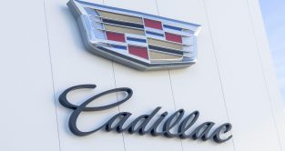 Cadillac dealership building exterior with logo. October 2022.