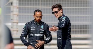 George Russell points something out to Mercedes team-mate Lewis Hamilton. Bahrain February 2023