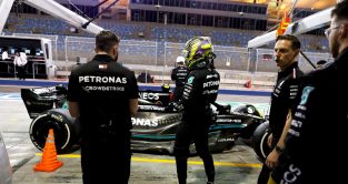 Lewis Hamilton standing in front of the Mercedes W14 in the pit lane. Bahrain February 2023
