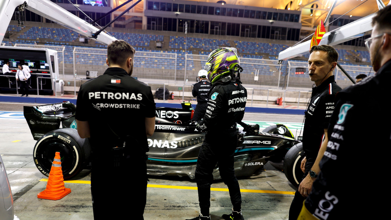 Lewis Hamilton standing in front of the Mercedes W14 in the pit lane. Bahrain February 2023