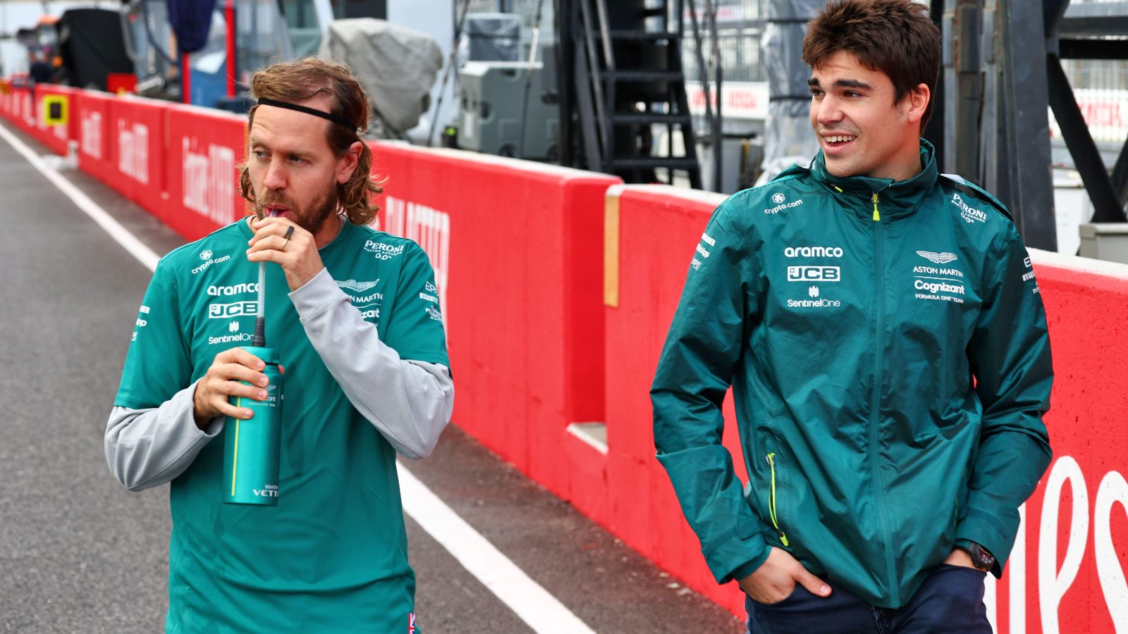 Aston Martin's Lance Stroll and Sebastian Vettel, Suzuka, October 2022.