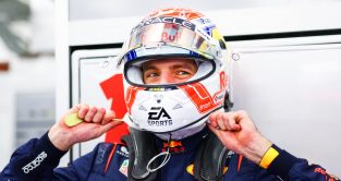 Max Verstappen smiling underneath his helmet. Bahrain, February 2023.