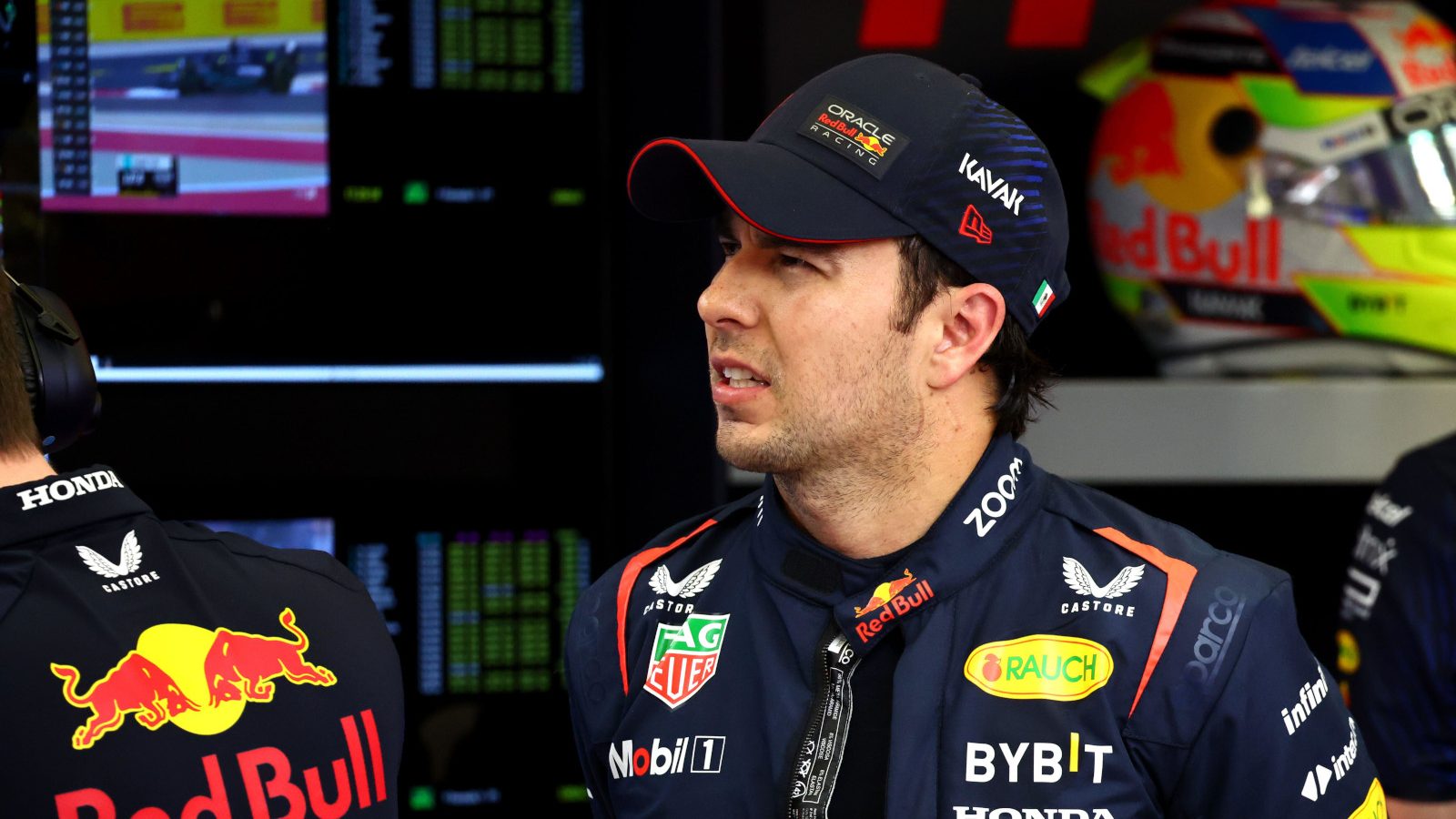 Sergio Perez staring in the Red Bull garage. Bahrain February 2023
