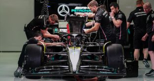 Mercedes mechanics raise the W14's engine cover. Bahrain March 2023
