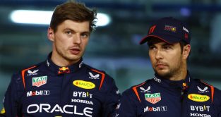 Max Verstappen speaks with Red Bull team-mate Sergio Perez. Bahrain, March 2023.
