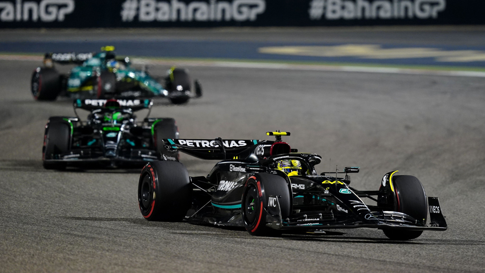 Lewis Hamilton and his team-mate George Russell being chased by Fernando Alonso. Bahrain March F1 2023