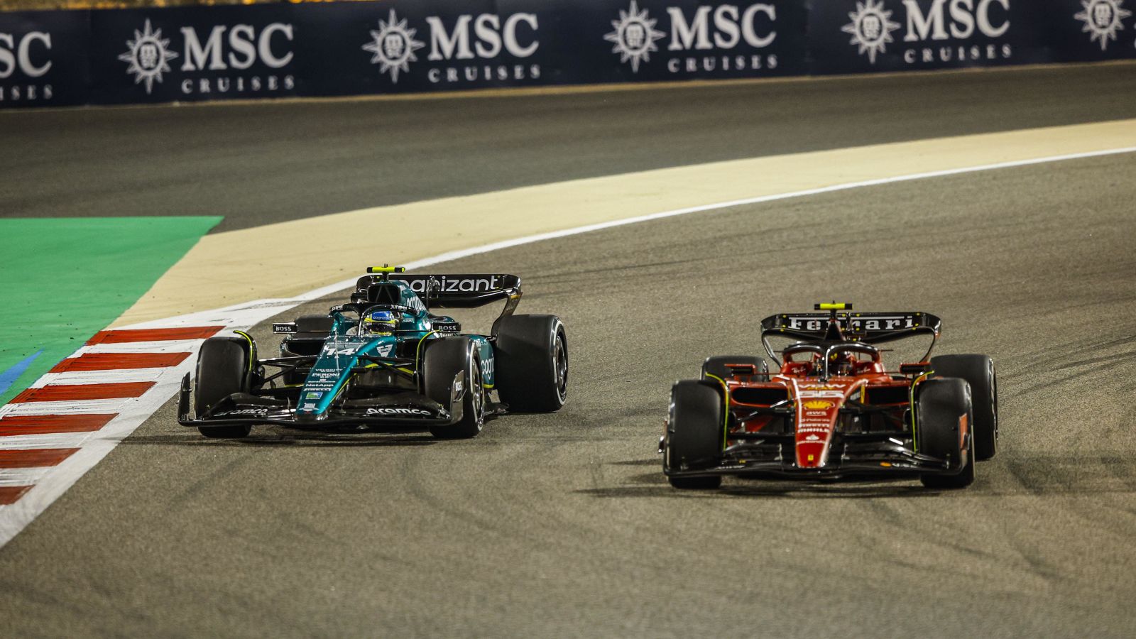 Fernando Alonso, Aston Martin, battles Carlos Sainz, Ferrari. Bahrain, March 2023.