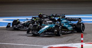 Fernando Alonso racing against Mercedes driver Lewis Hamilton, up the inside. Bahrain March 2023