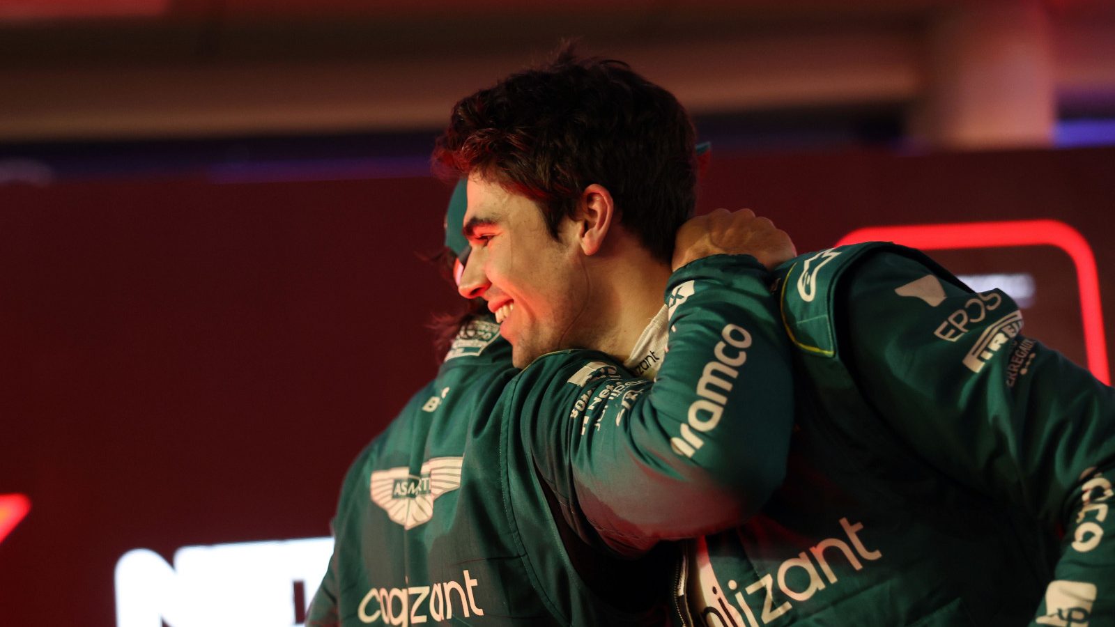 Lance Stroll hugs Fernando Alonso after his podium finish. Bahrain March 2023.