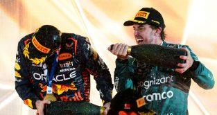 Race winner Max Verstappen is sprayed by third placed Fernando Alonso. Bahrain March 2023
