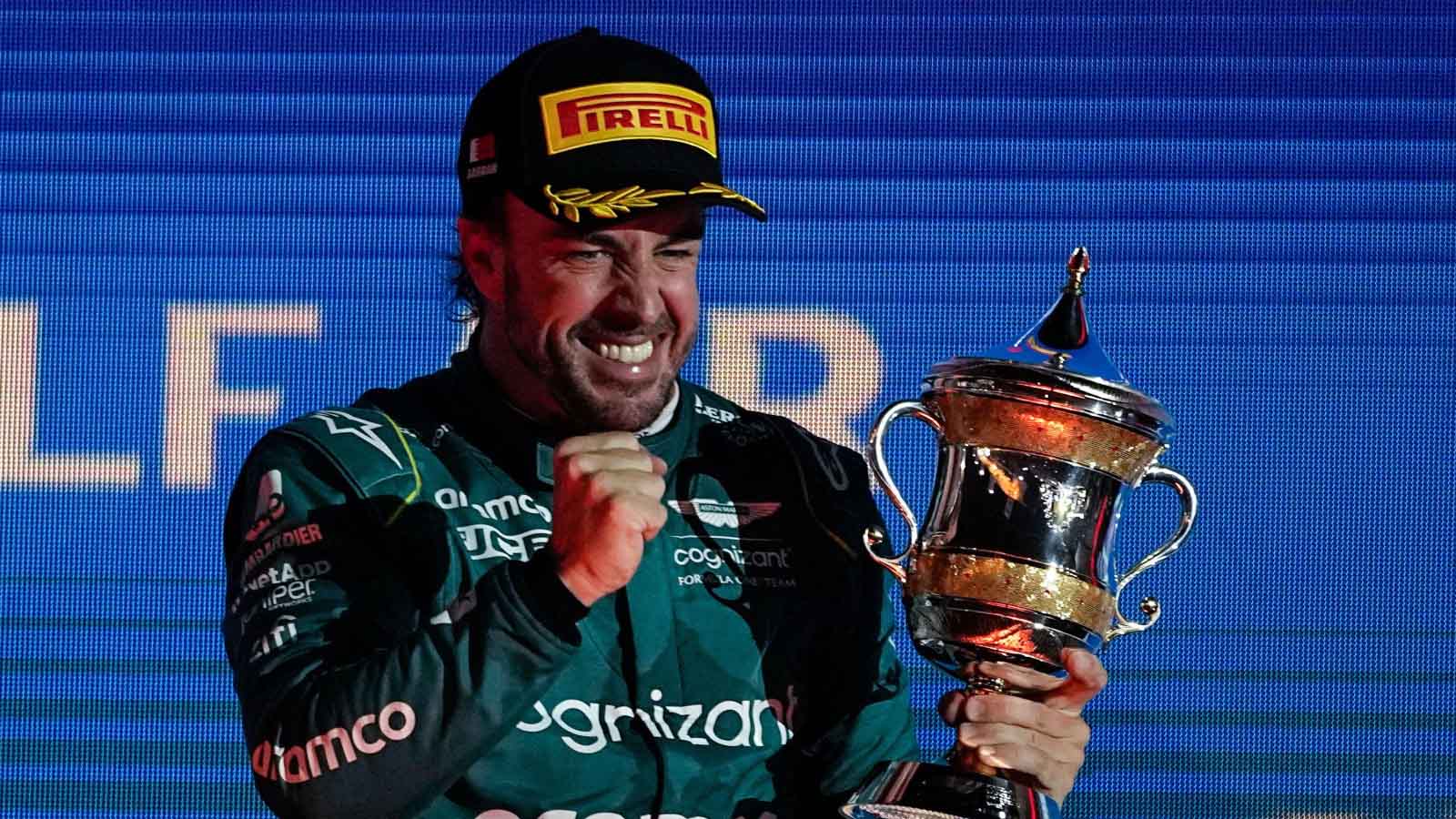 Fernando Alonso celebrates on the podium.