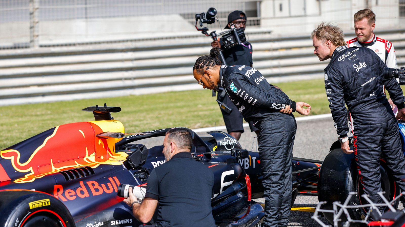 Lewis Hamilton and Valtteri Bottas looking at the Red Bull RB19. Bahrain February 2023