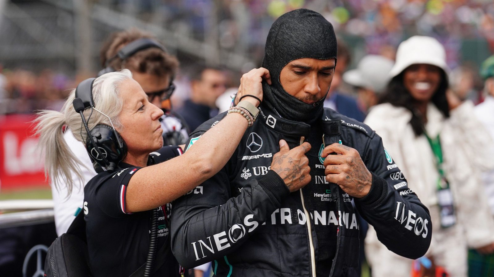 Angela Cullen assists Lewis Hamilton on the grid. Silverstone July 2022