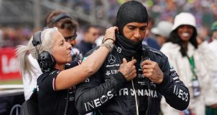 Angela Cullen assists Lewis Hamilton on the grid. Silverstone July 2022