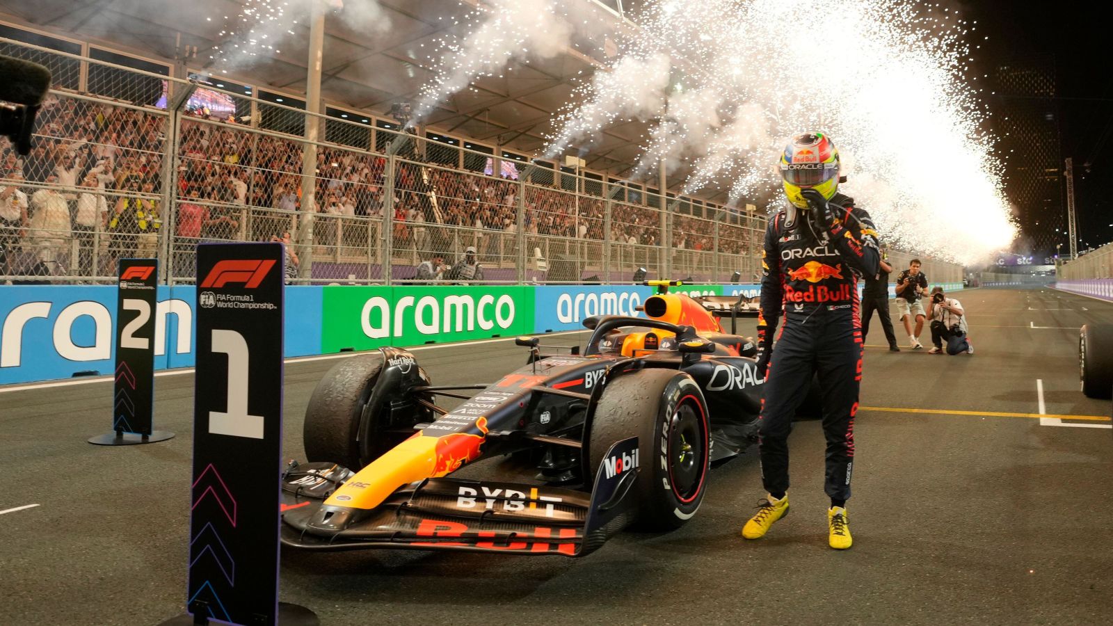 Race winner Sergio Perez stands next to the Red Bull. Saudi Arabia, March 2023.