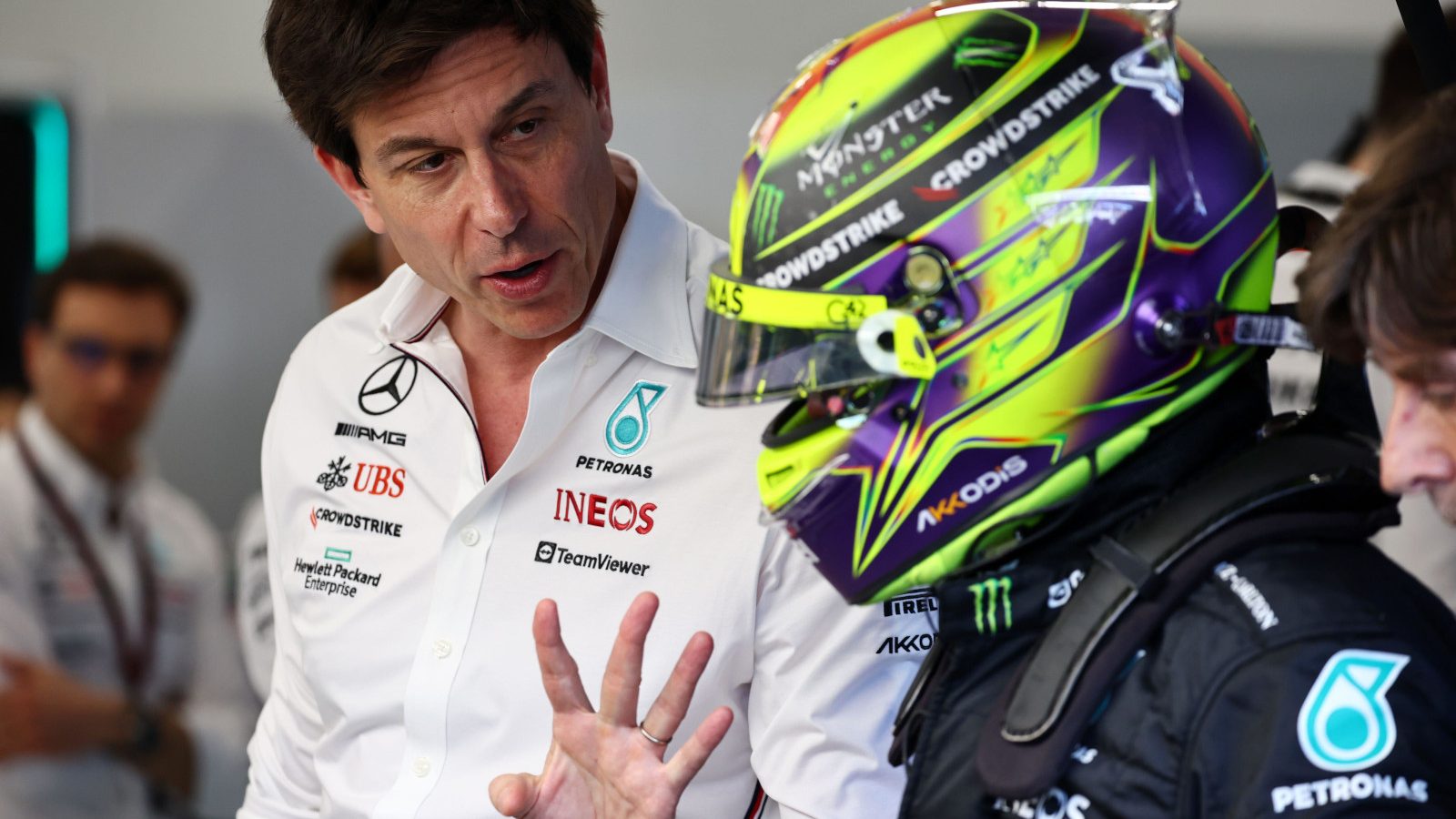 Mercedes team principal Lewis Hamilton speaking to Toto Wolff in the garage, hand gesture. Saudi Arabia March 2023