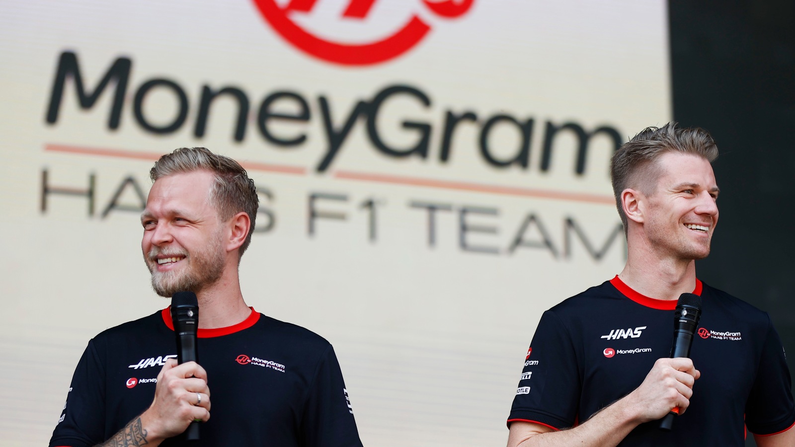 Kevin Magnussen and Nico Hülkenberg smiling. Bahrain, March 2023.