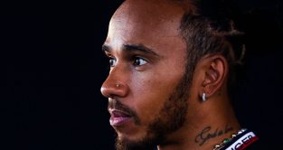 Lewis Hamilton looks concerned.