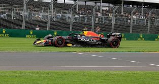Sergio Perez drives his Red Bull over the grass. Australia, April 2023.