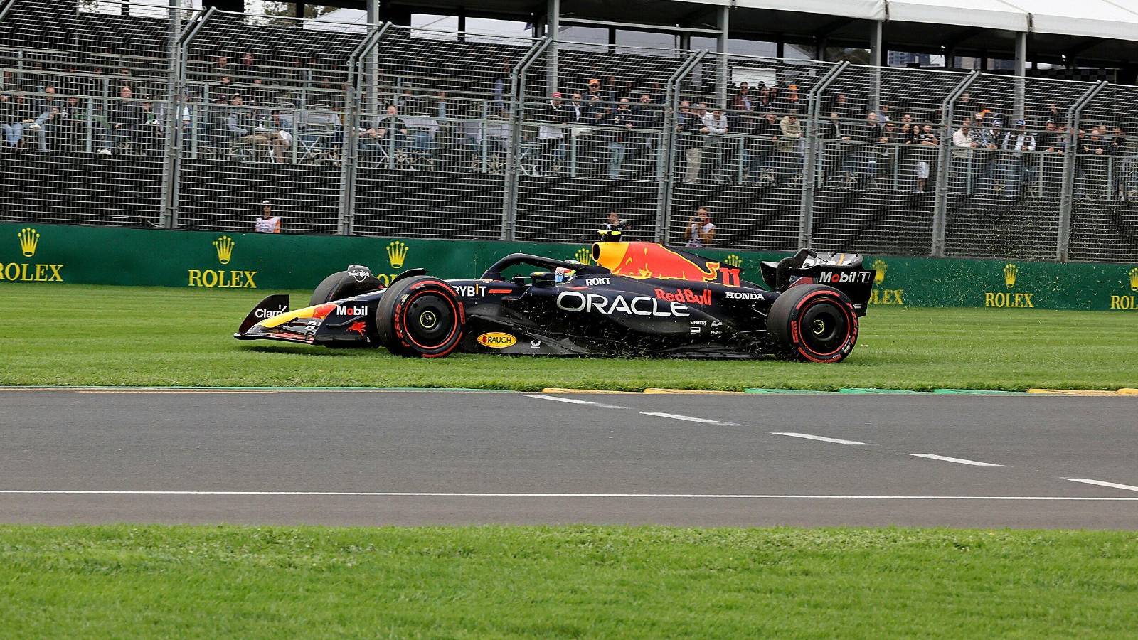 Sergio Perez drives his Red Bull over the grass. Australia, April 2023.