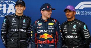 Max Verstappen laughs next to George Russell and Lewis Hamilton. Melbourne, April 2023.