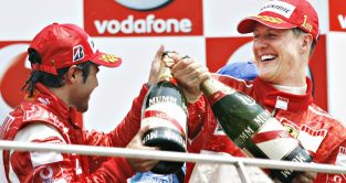 Felipe Massa and Michael Schumacher, Ferrari, celebrate. United States, July 2006.
