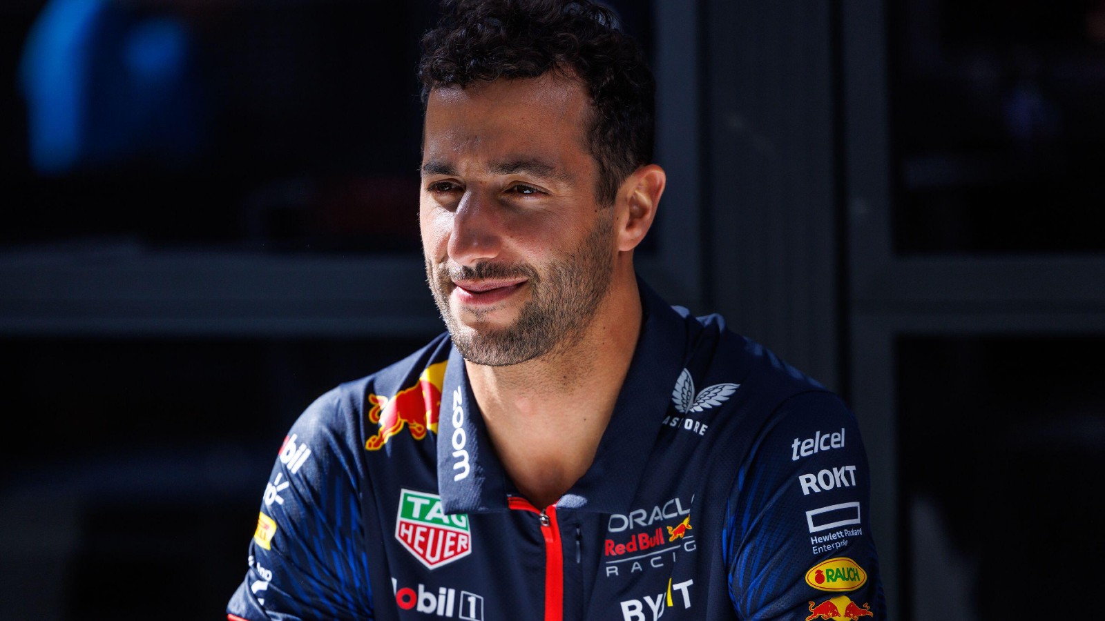 Daniel Ricciardo, Red Bull, sat down and smiling. Australia, March 2023.