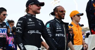 Mercedes driver Lewis Hamilton chats with Alfa Romeo driver Valtteri Bottas. Bahrain, March 2023.