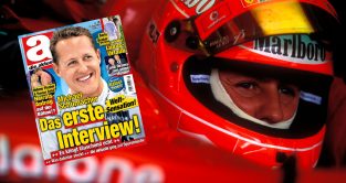 Ferrari driver Michael Schumacher looks on.