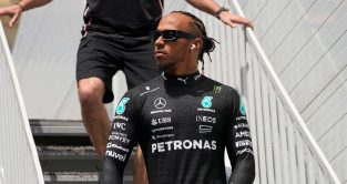 Lewis Hamilton walks down stairs. Baku April 2023.