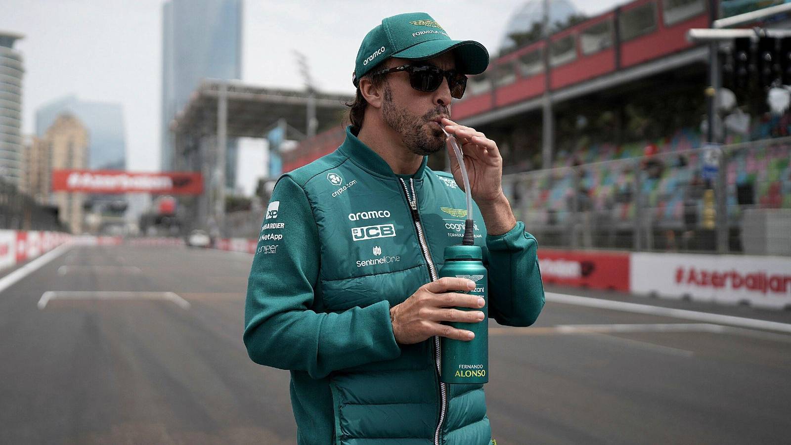 Fernando Alonso, Aston Martin, on the grid with drink. Azerbaijan, April 2023.