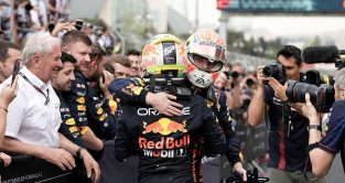 Red Bull's Sergio Perez and Max Verstappen embrace after the Azerbaijan Grand Prix. Baku, April 2023.