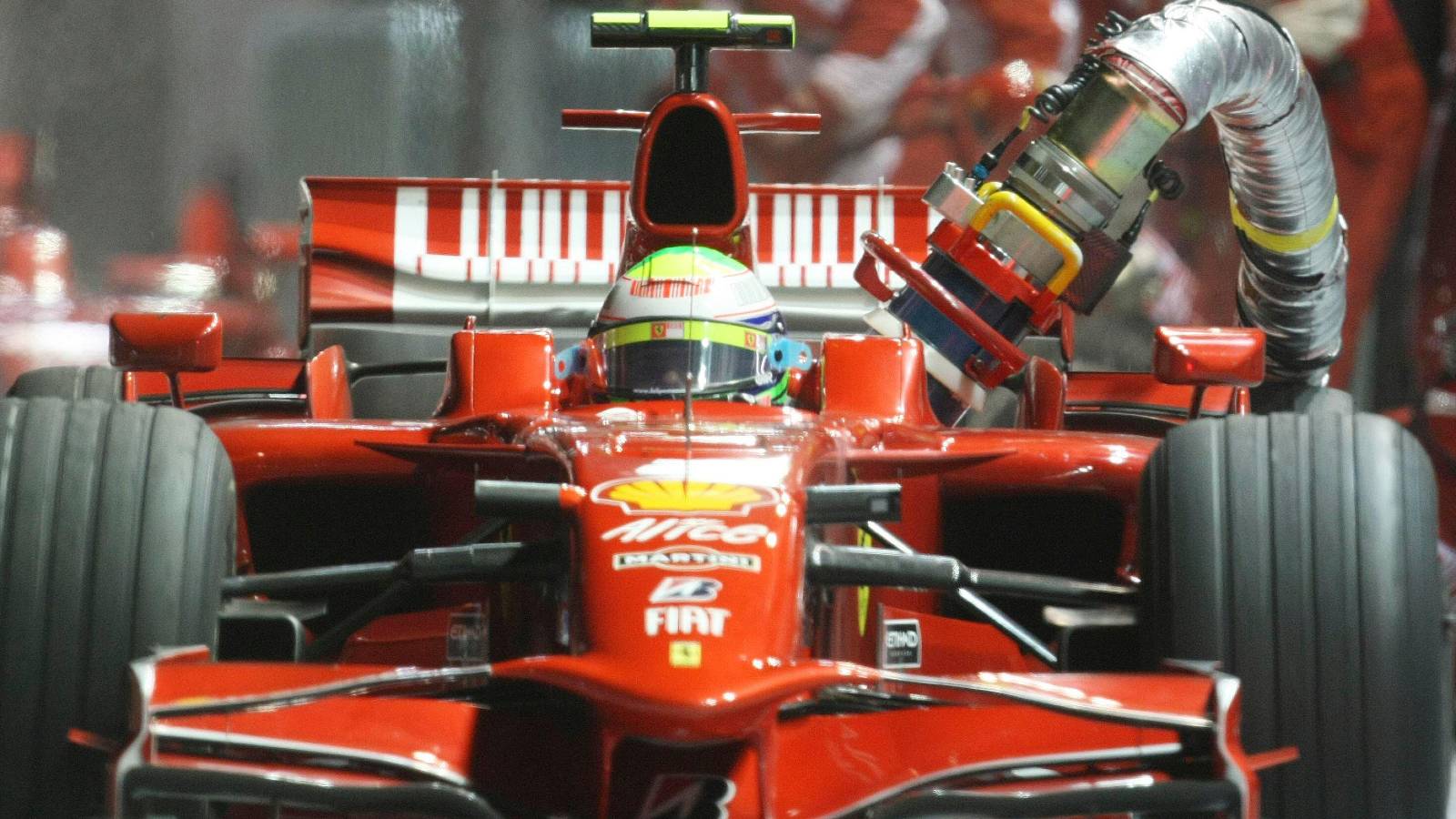 Felipe Massa, Ferrari, with fuel hose attached. Singapore, September 2008.