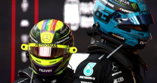 Mercedes drivers Lewis Hamilton and George Russell look on in parc ferme at the end of the Azerbaijan Grand Prix. Baku, 2023.