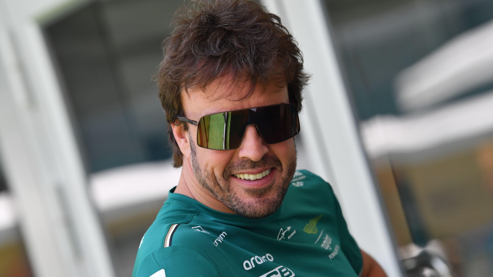Fernando Alonso smiling wearing sunglasses. Miami, May 2023.