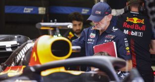 Adrian Newey inspecting the RB19 with his notebook in hand. Bahrain March 2023
