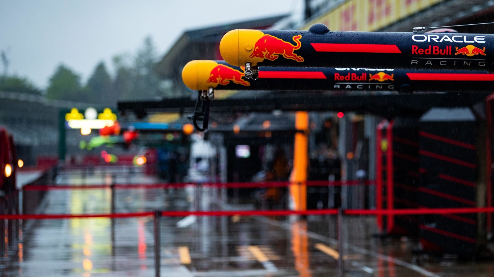 An empty Red Bull pit box as rain hammers down during preparations for the 2022 Emilia Romagna Grand Prix. Imola, 2022.