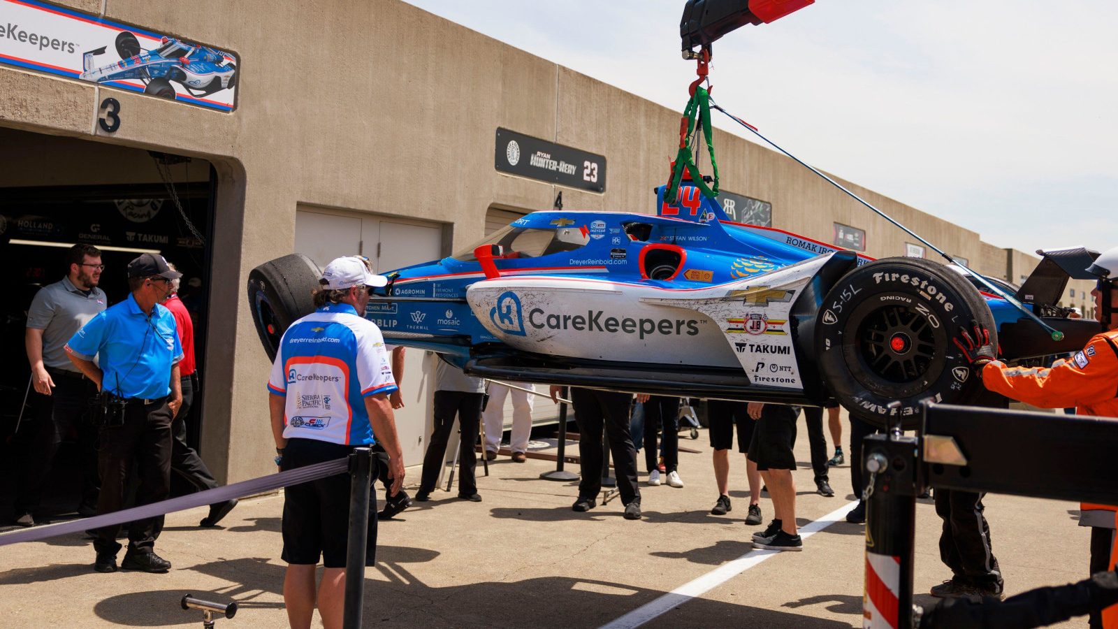 Stefan Wilson's crashed car taken back to the garage. Indianapolis May 2023