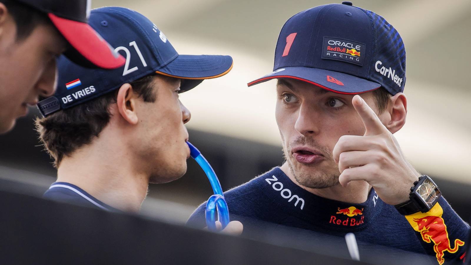 Max Verstappen and Nyck de Vries talk. Bahrain, March 2023.