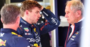 Red Bull driver Max Verstappen with his hand to his head, speaking with Helmut Marko and Christian Horner. Baku April 2023