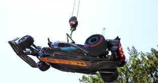 Mercedes' Lewis Hamilton's car is craned away at the 2023 Monaco Grand Prix. Monte Carlo, May 2023.