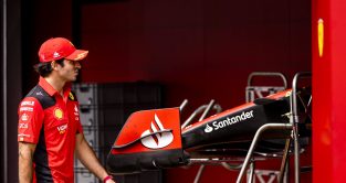 Carlos Sainz walking past the Ferrari garage and SF-23 noses. Spain May 2023
